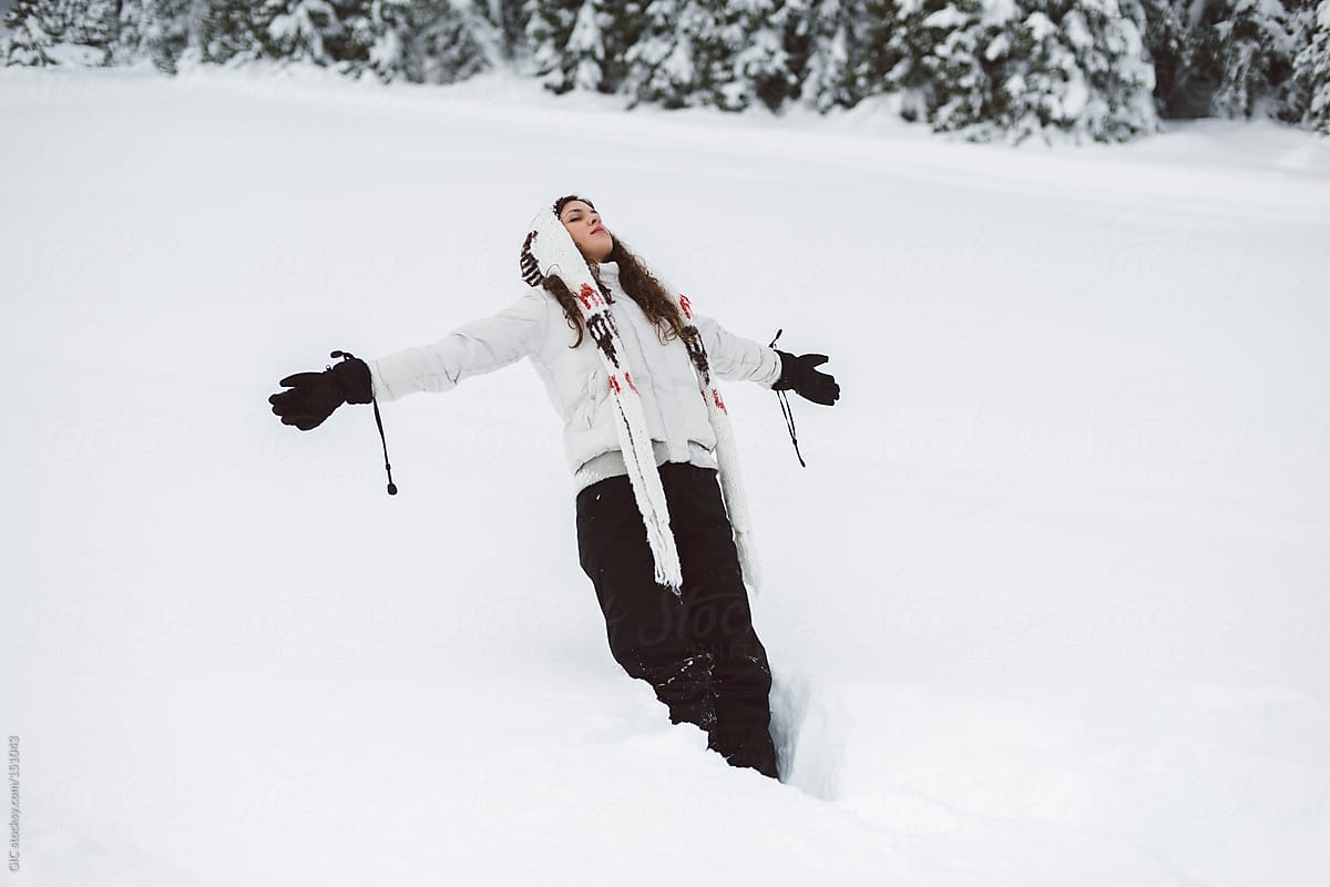 Woman Playing With Snow By Stocksy Contributor Simone Wave Stocksy