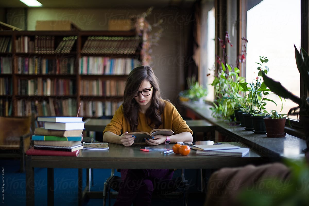 Woman Studying At The Library Del Colaborador De Stocksy Lumina