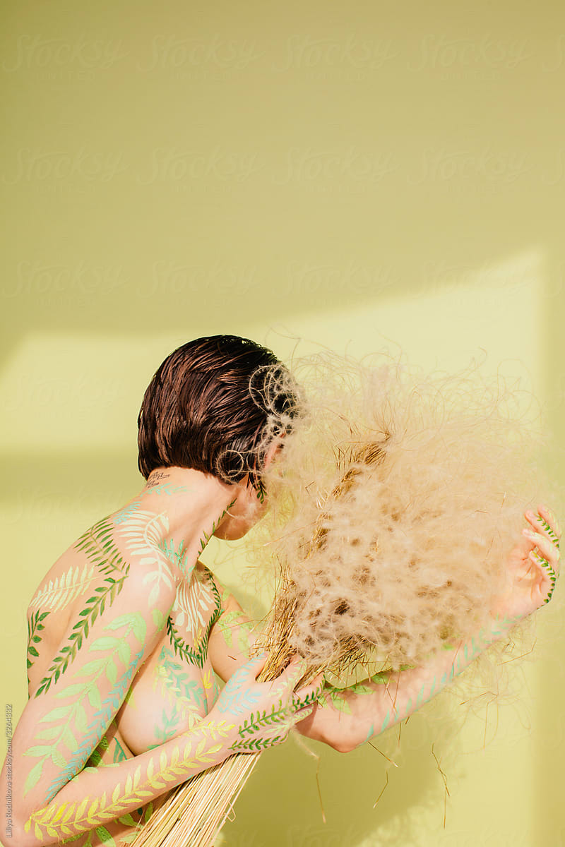 Naked Woman With Dried Plants Del Colaborador De Stocksy Liliya