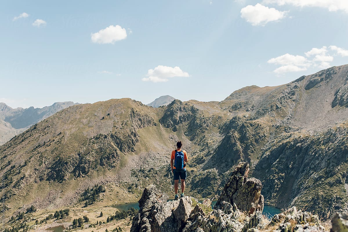 Man Hiker Standing On Mountain Cliff Del Colaborador De Stocksy Blue Collectors Stocksy