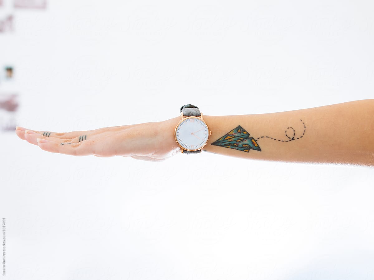 Detail Of Arm With Wrist Watch And A Tattooed Airplane By Stocksy Contributor Susana Ram Rez