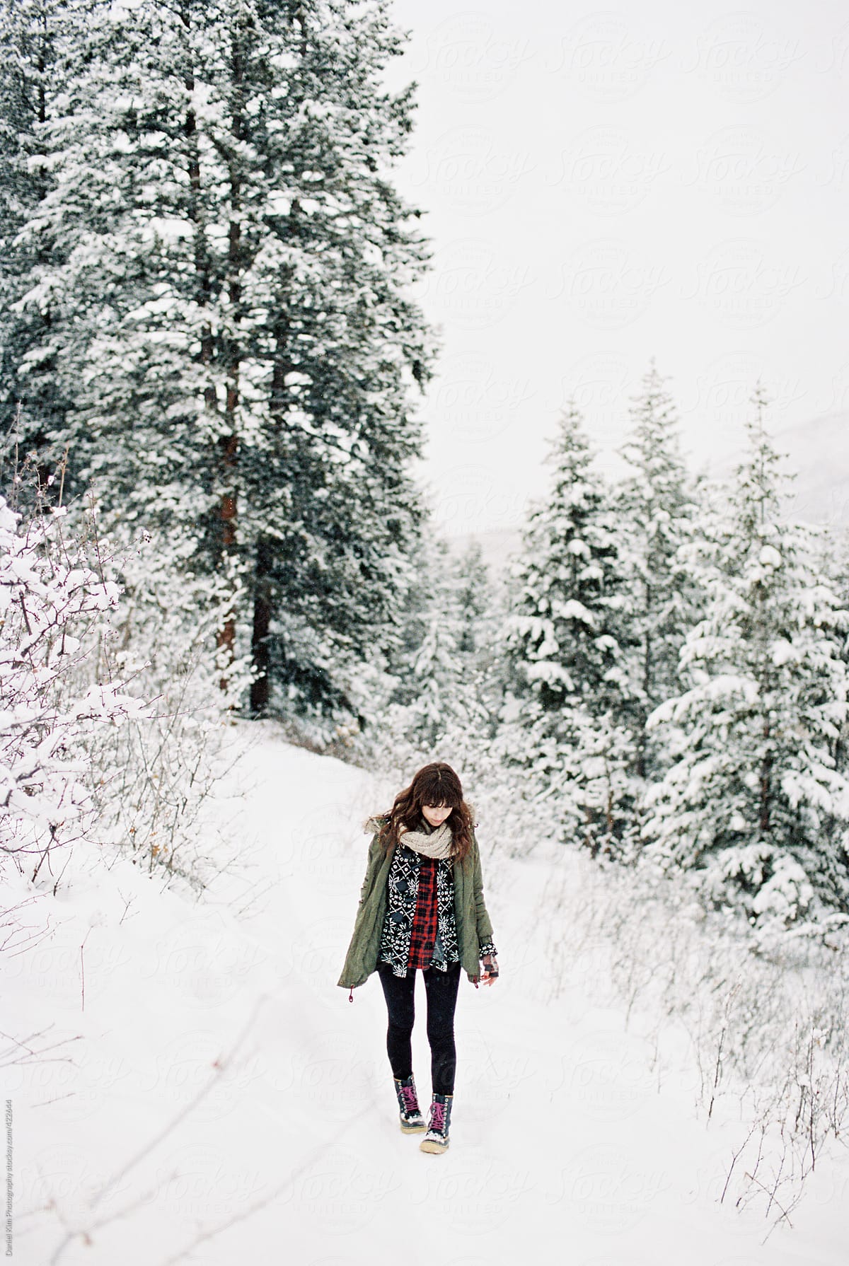 Brunette Girl Standing In Snow By Stocksy Contributor Daniel Kim