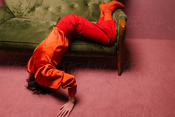 Woman Lying Down On The Floor Of A Room by Stocksy Contributor  Ulas&Merve - Stocksy