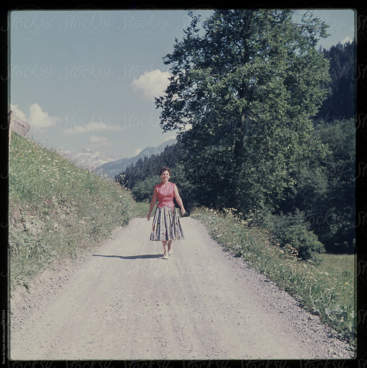 woman walking on mountain road