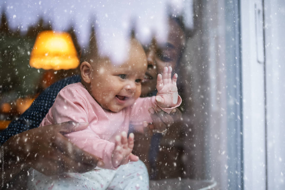 Laughing child watching snow