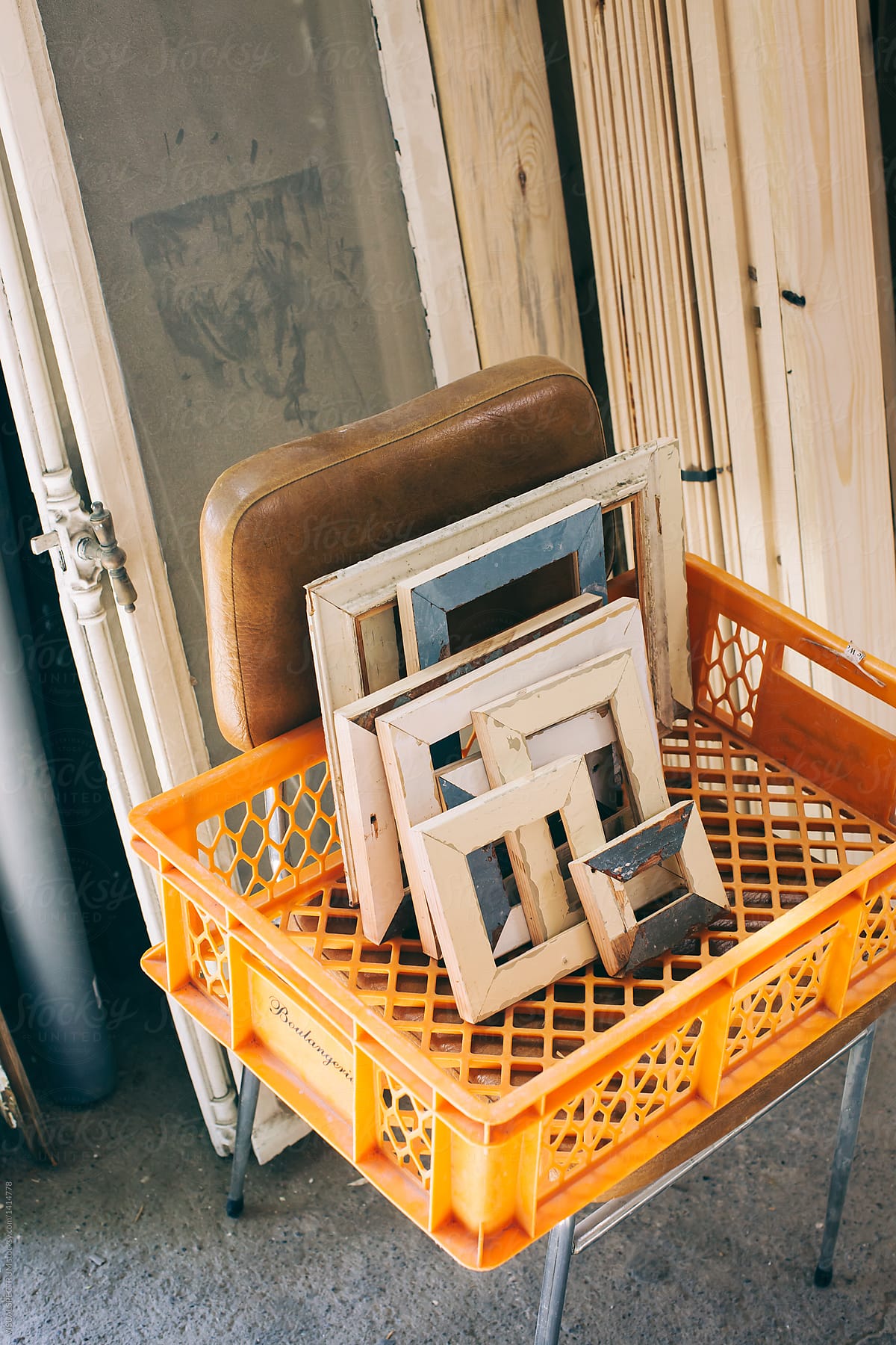 Wooden Picture Frames Made of Reclaimed Wood Standing in Orange Plastic Crate