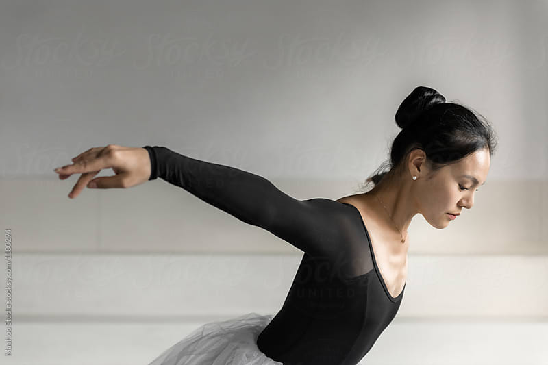 Young professional female dancer practicing in a studio