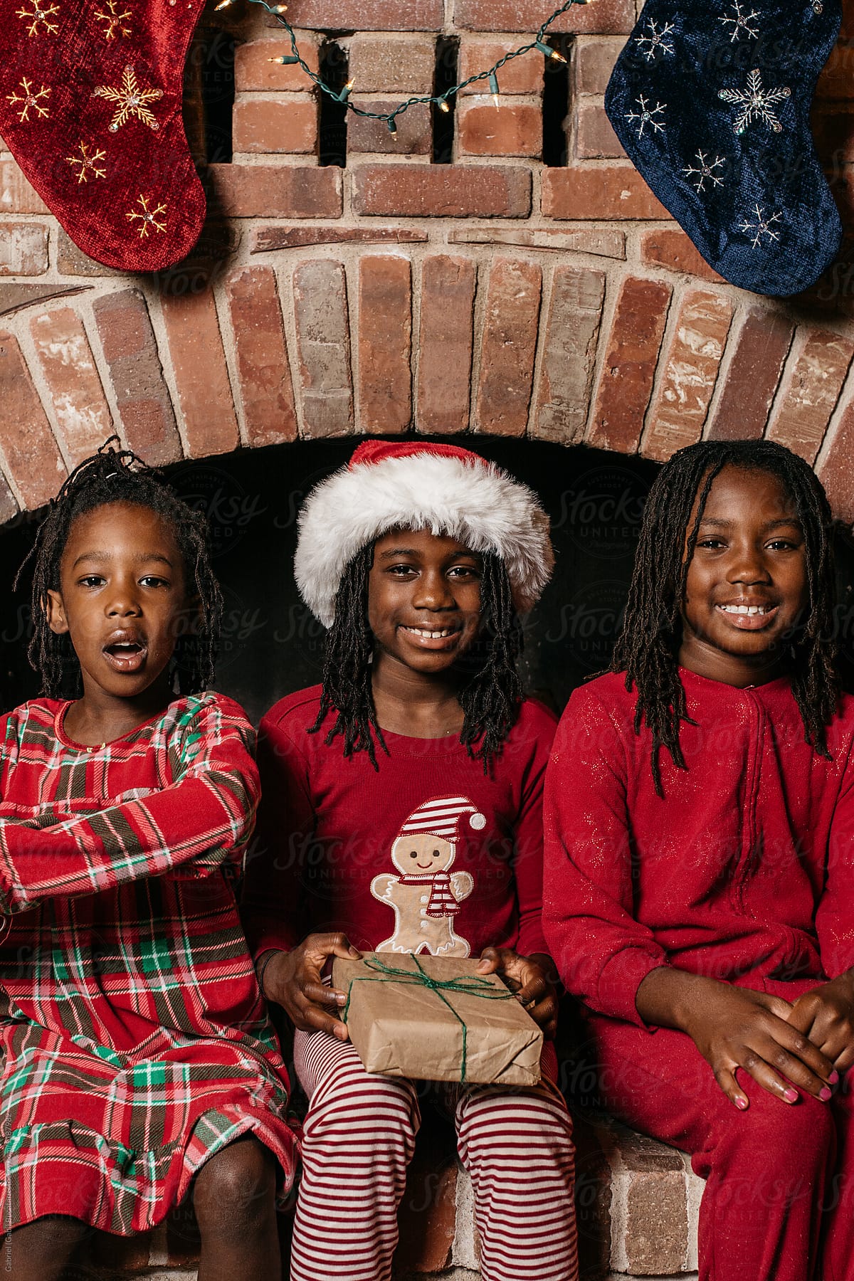 Three Black Girls Wearing Christmas Pajamas By Stocksy Contributor Gabi Bucataru Stocksy