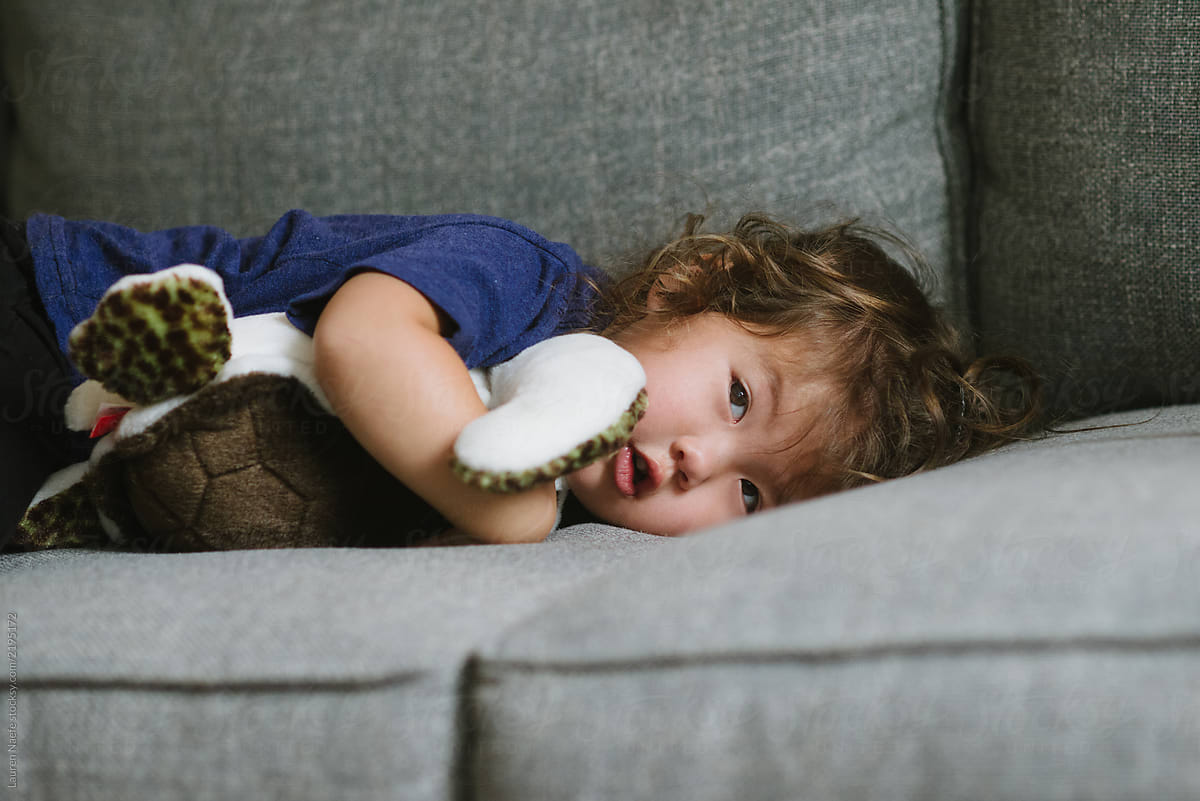 Child resting on couch