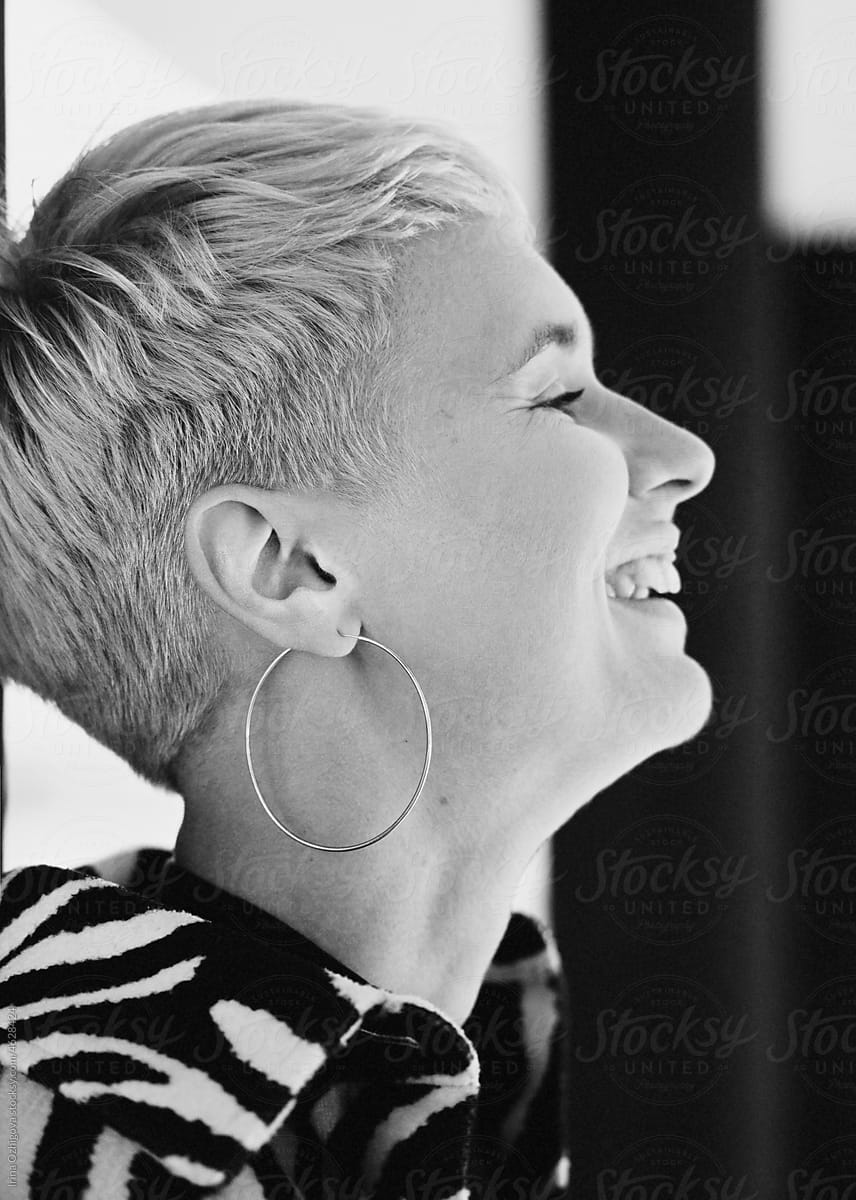 Black and white portrait of a laughing woman