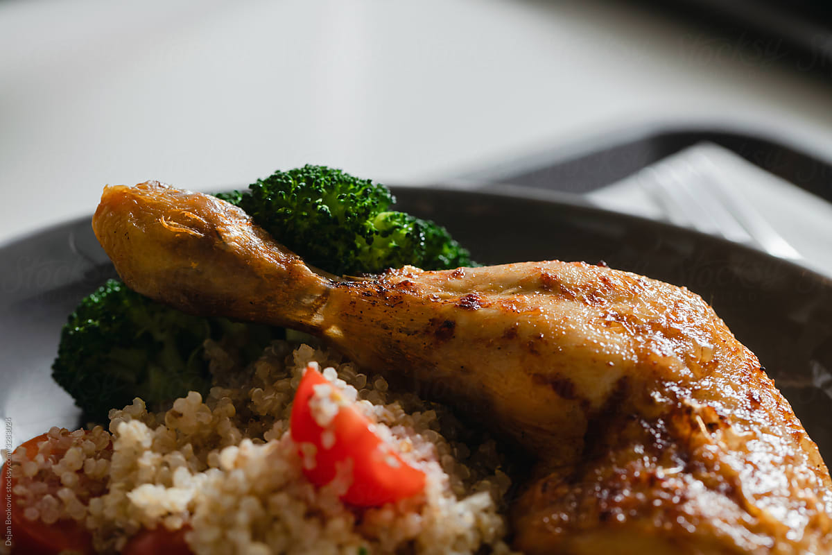 Baked Chicken Leg With Quinoa And Steamed Broccoli.