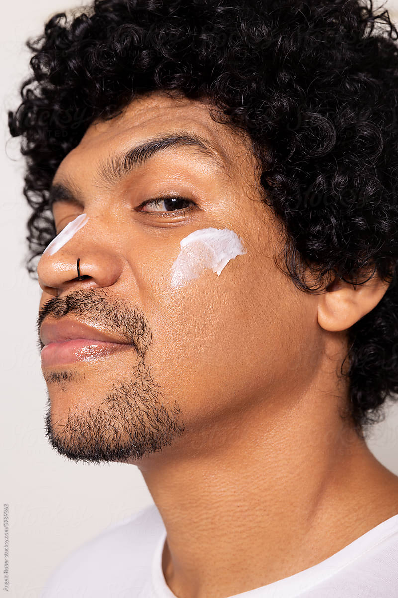 Close-up of Man with Moisturizer