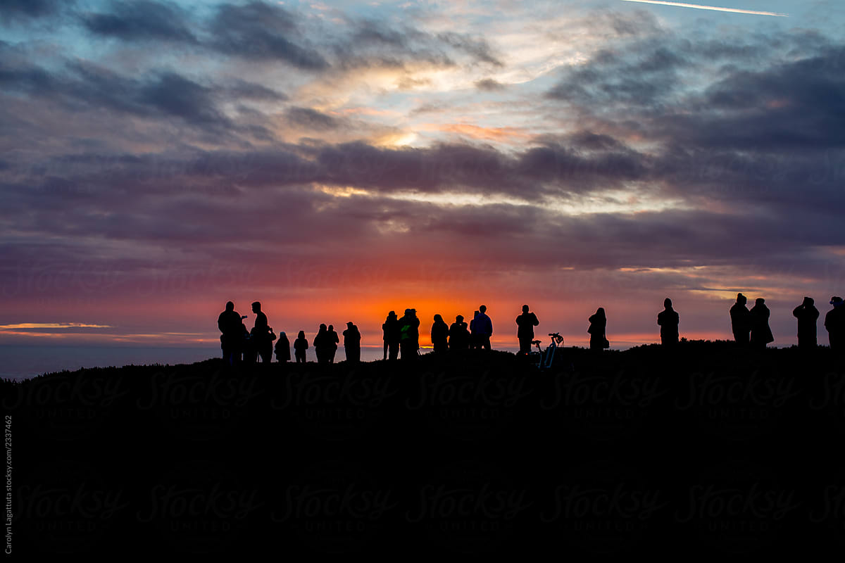 People gathering to watch the sunset