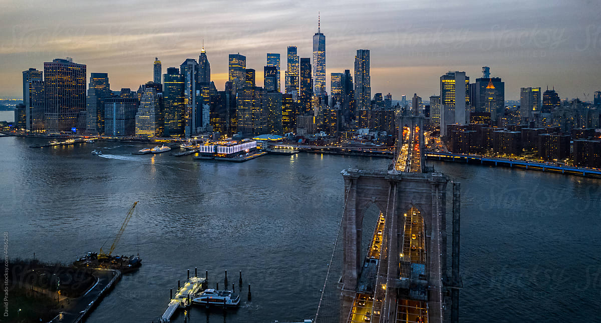 Drone view of Manhattan, New York City and Brooklyn bridge at sunset