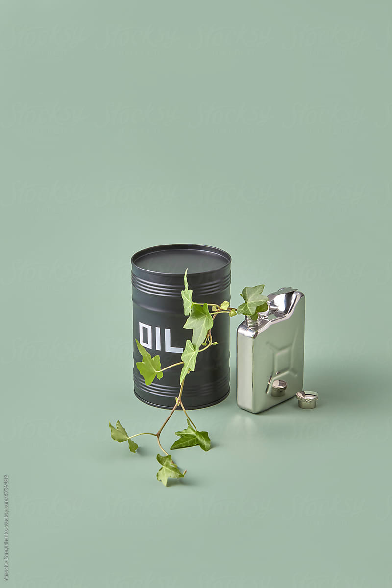 Aluminum canister with plant and oil barrel.