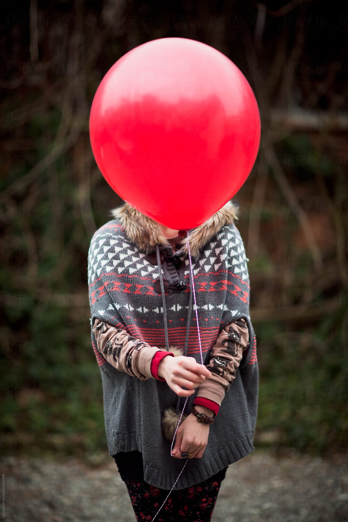 Woman Hiding Face Behind Balloon Del Colaborador De Stocksy Laura 
