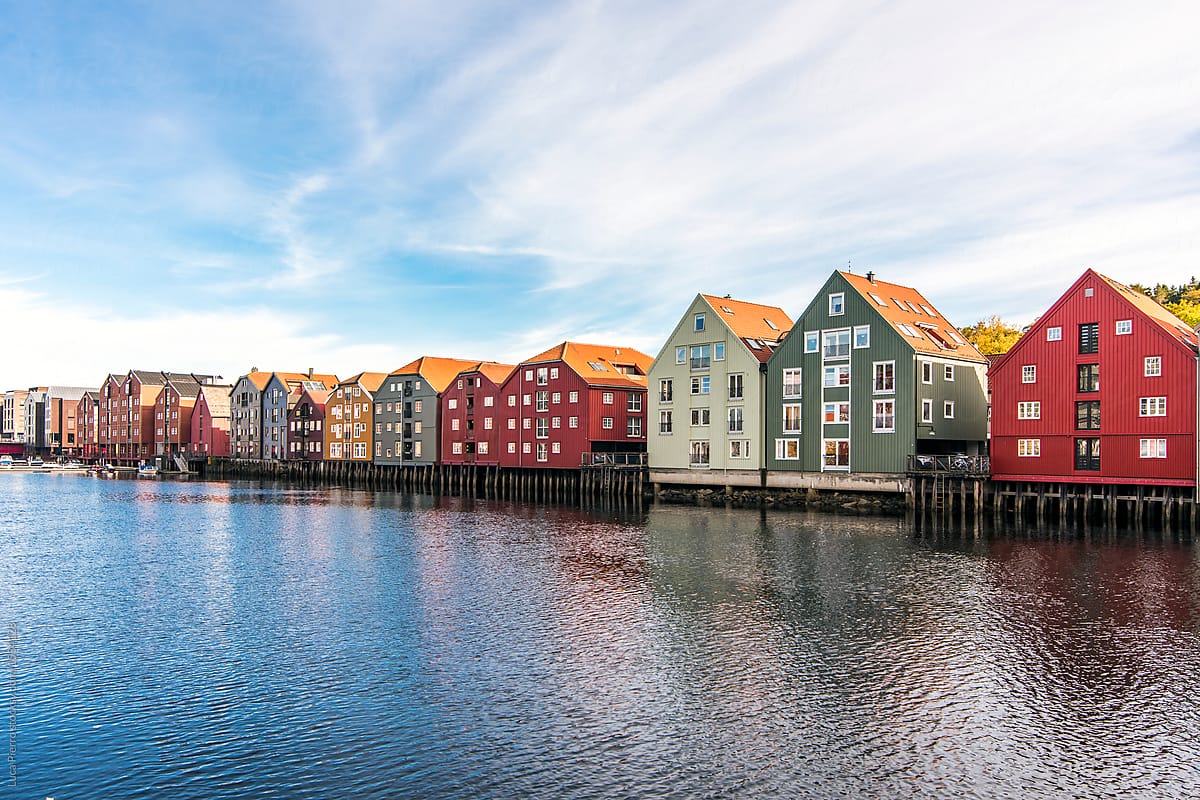Colored Houses Along Nidelva River In Trondheim, Norway" by Stocksy Contributor "Sky-Blue Creative" - Stocksy