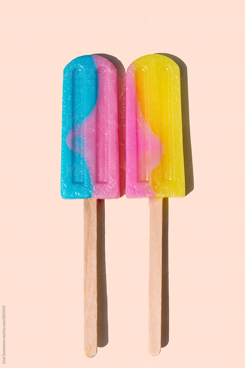 Two icecream lollies on a wooden stick