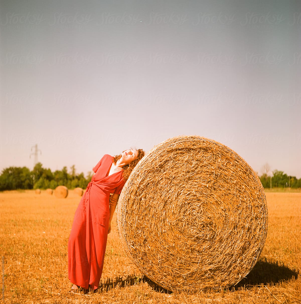 Lady in red in a grain field