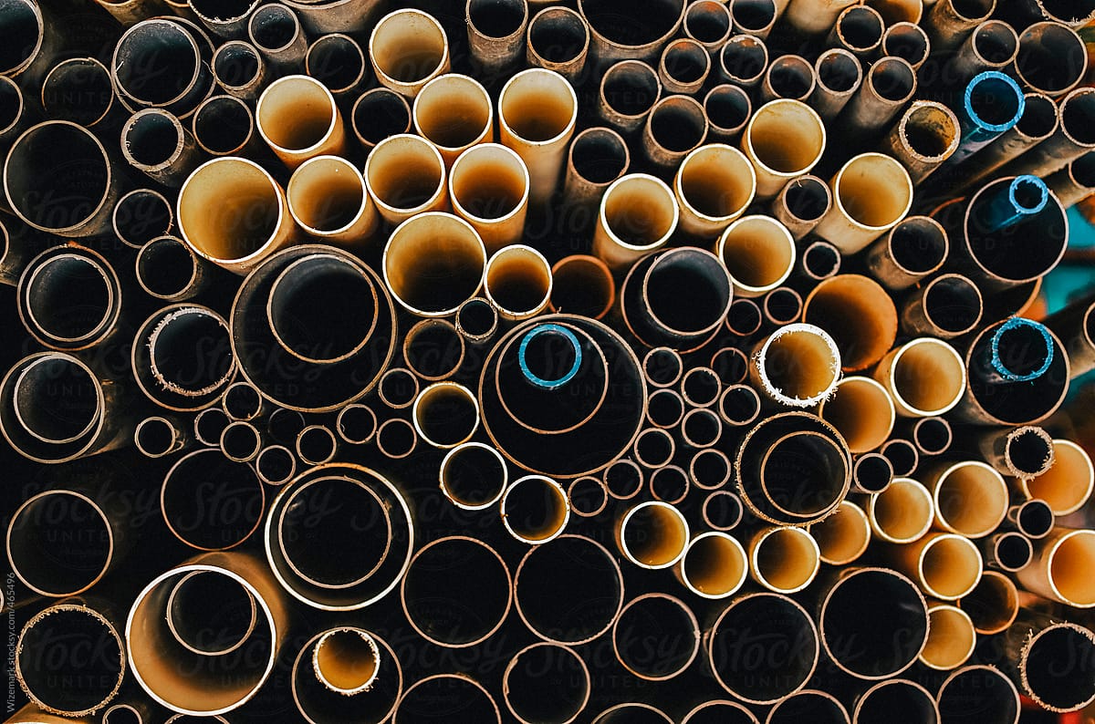 Bunch of stacked plastic pipes create a pattern