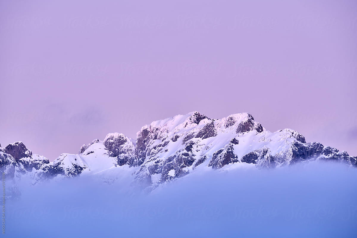 Severe Landscape With Snowy Rocky Mountain Peak