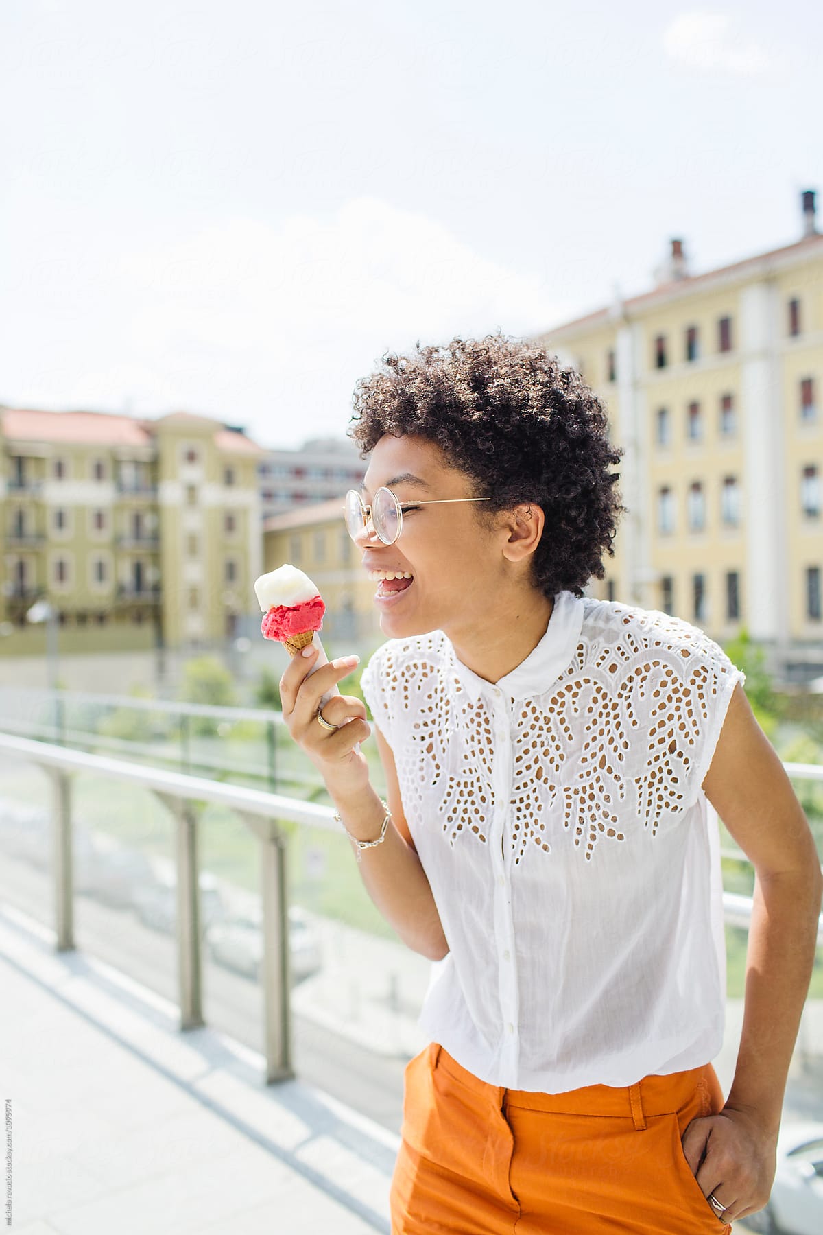 Girl eating an ice cream in a sunny day