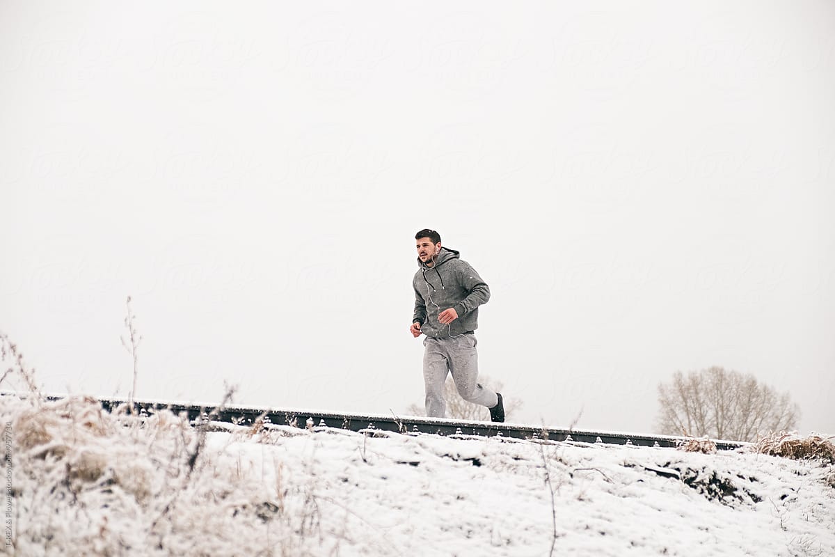 Energetic man running in winter