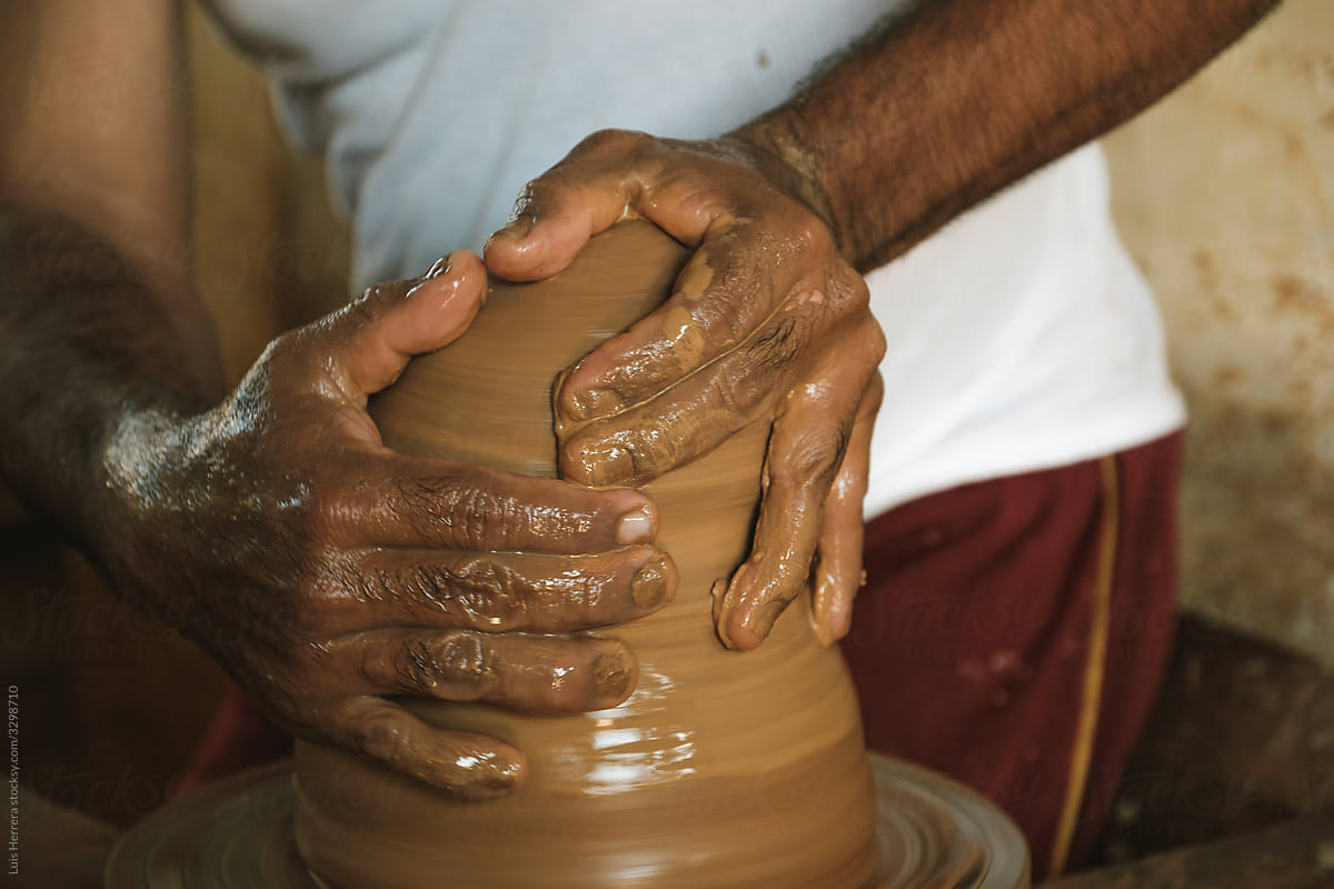 artisan working on a pottery wheel