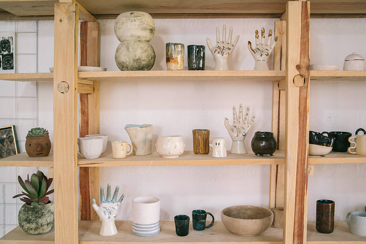 Shelf showcasing ceramic objects