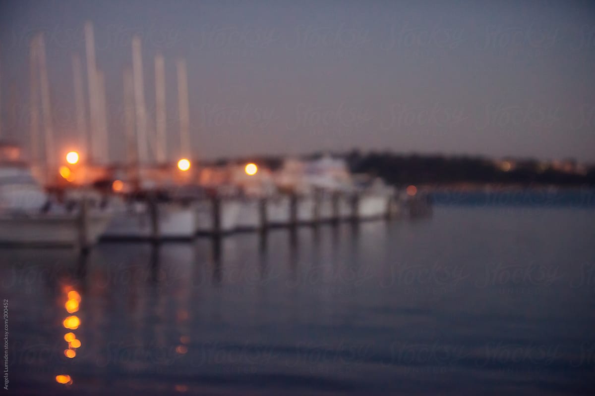 Yachts moored at a yacht club at dusk