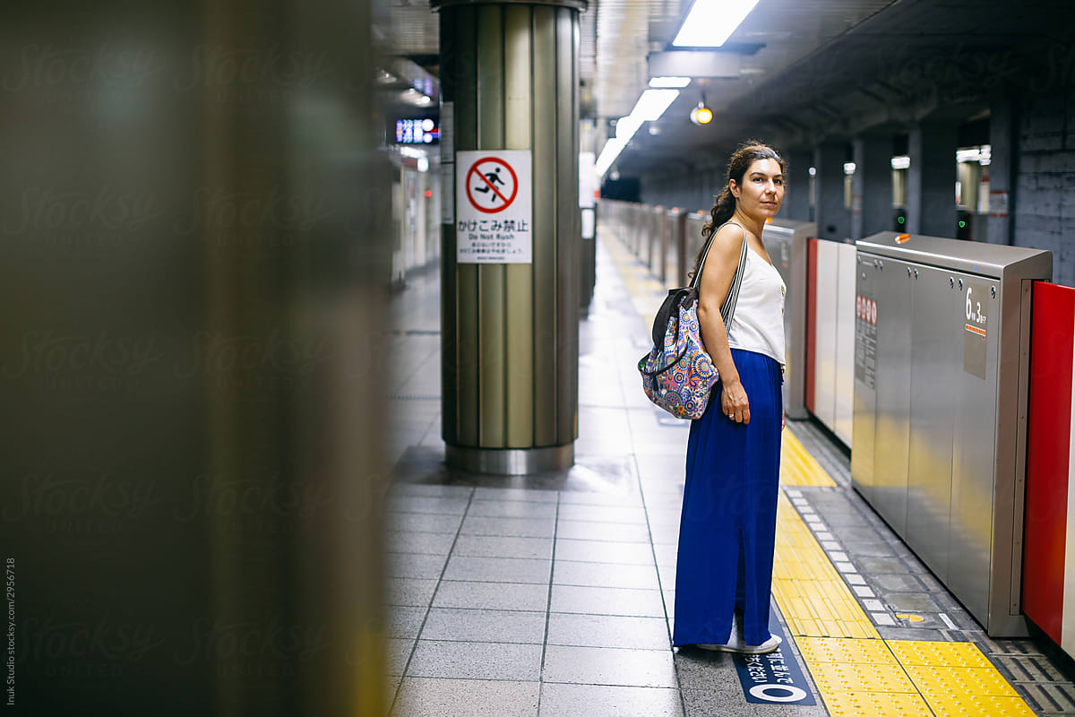 Female traveler on subway station