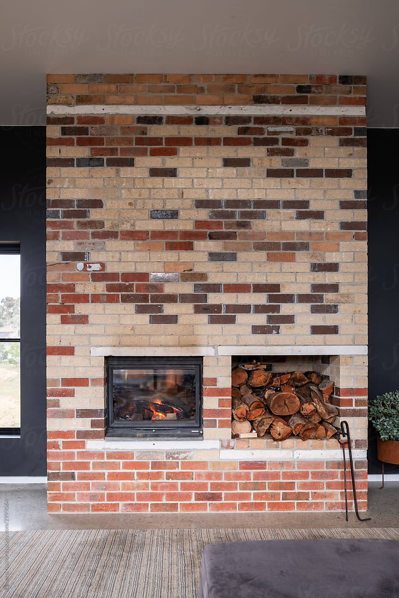 Contemporary home with brick thermal mass designed fireplace