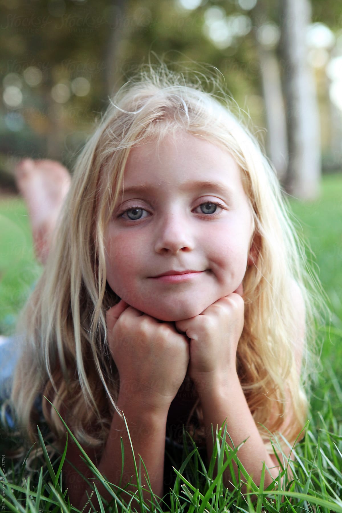 Portrait Of Young Blonde Girl Looking Bored By Dina Marie Giangregorio