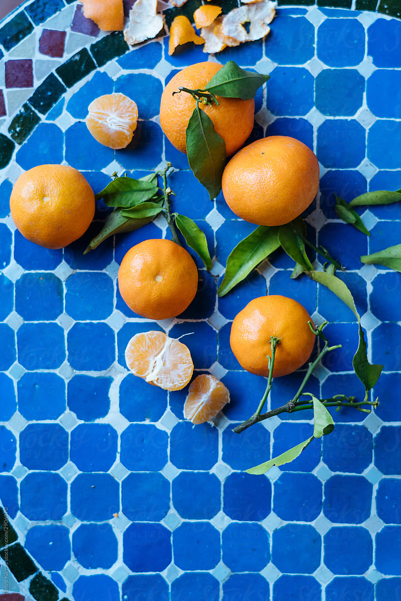 Tangerines on blue checkered table