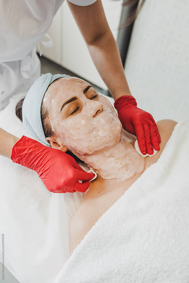 Cosmetologist doing skincare procedures in spa beauty salon
