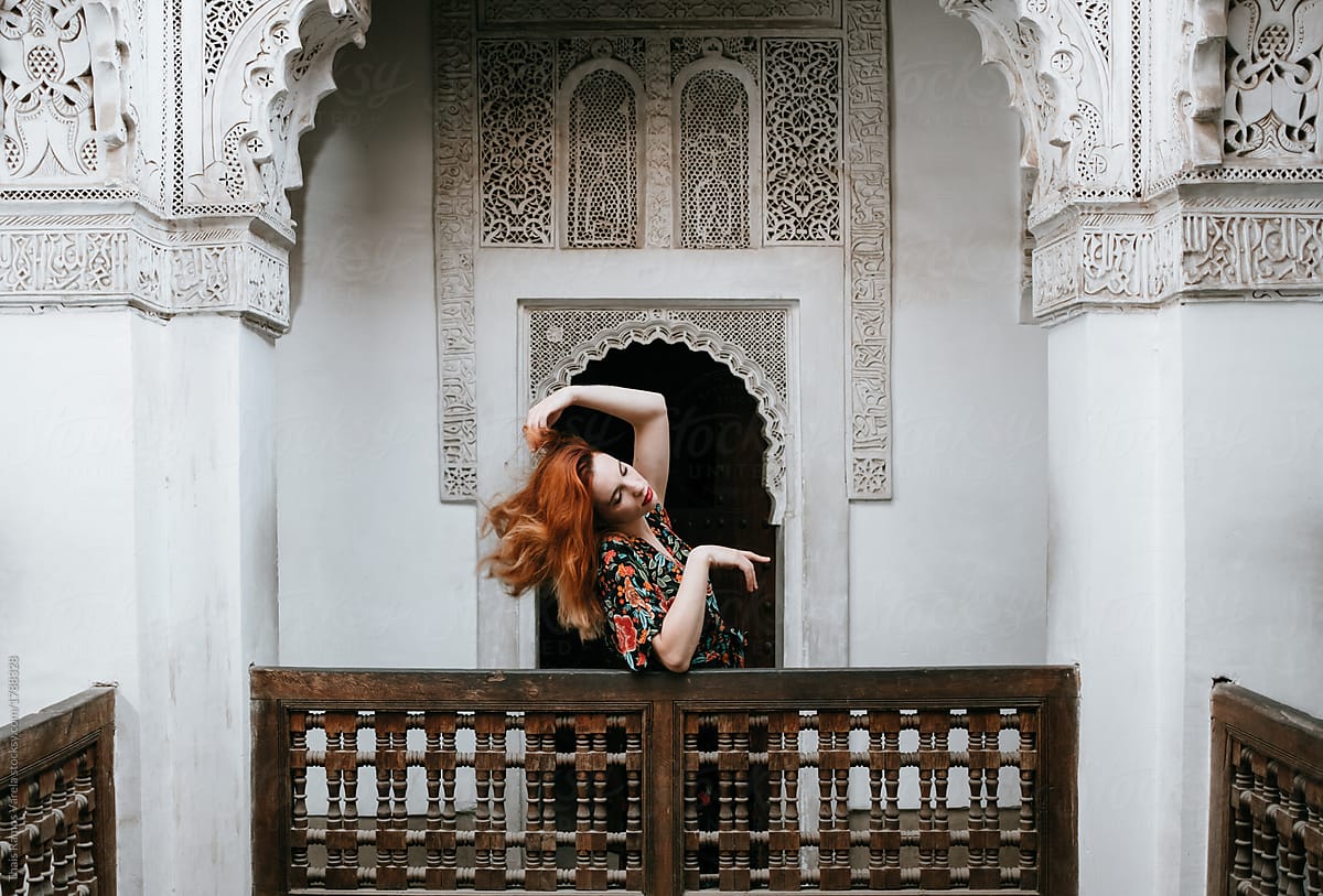ginger woman posing in a beautiful arabic mosque