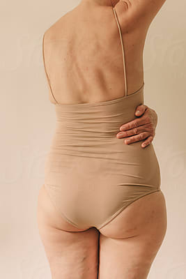 Crop Mature Woman In Neutral Underwear by Stocksy Contributor