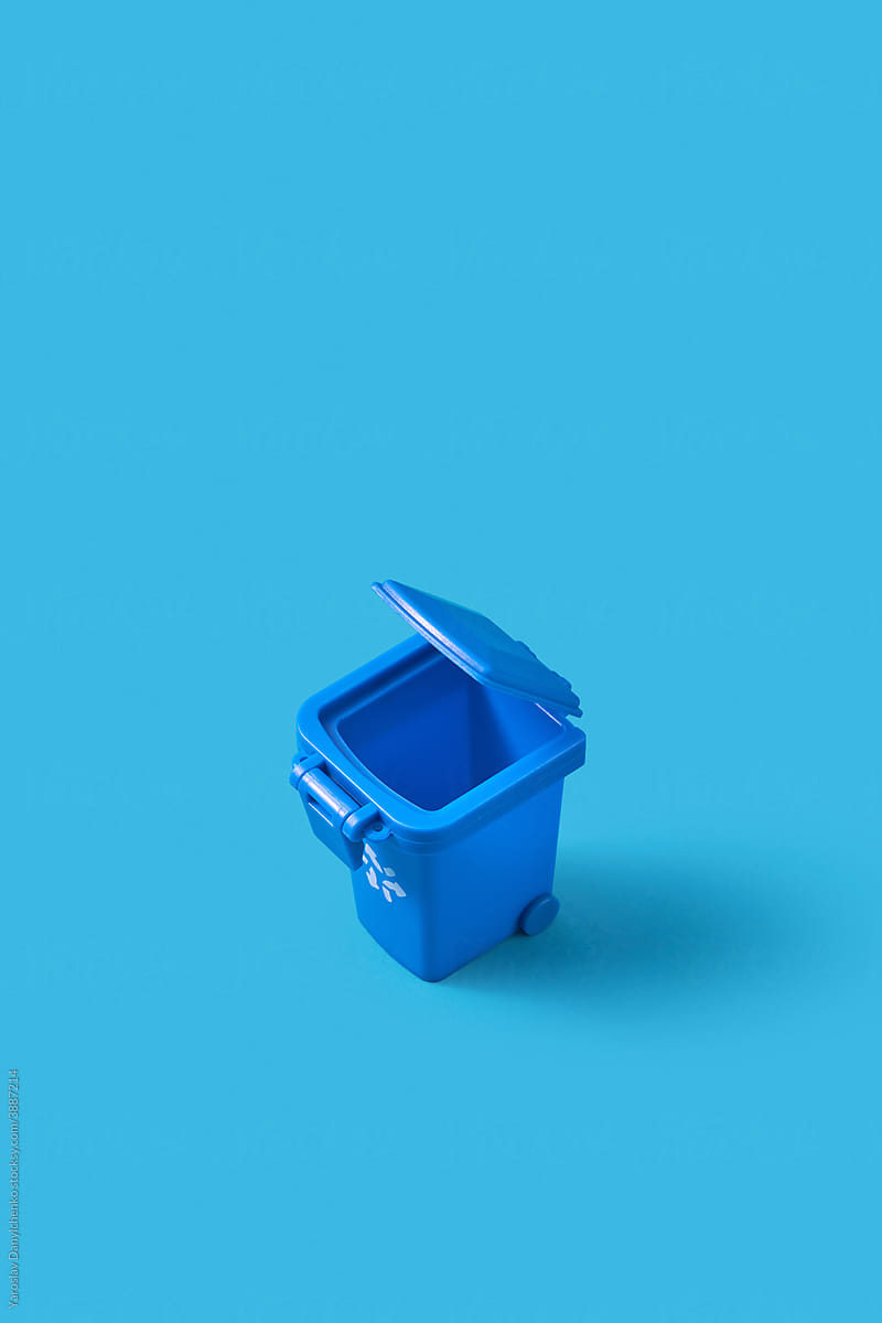 Small open blue trash can