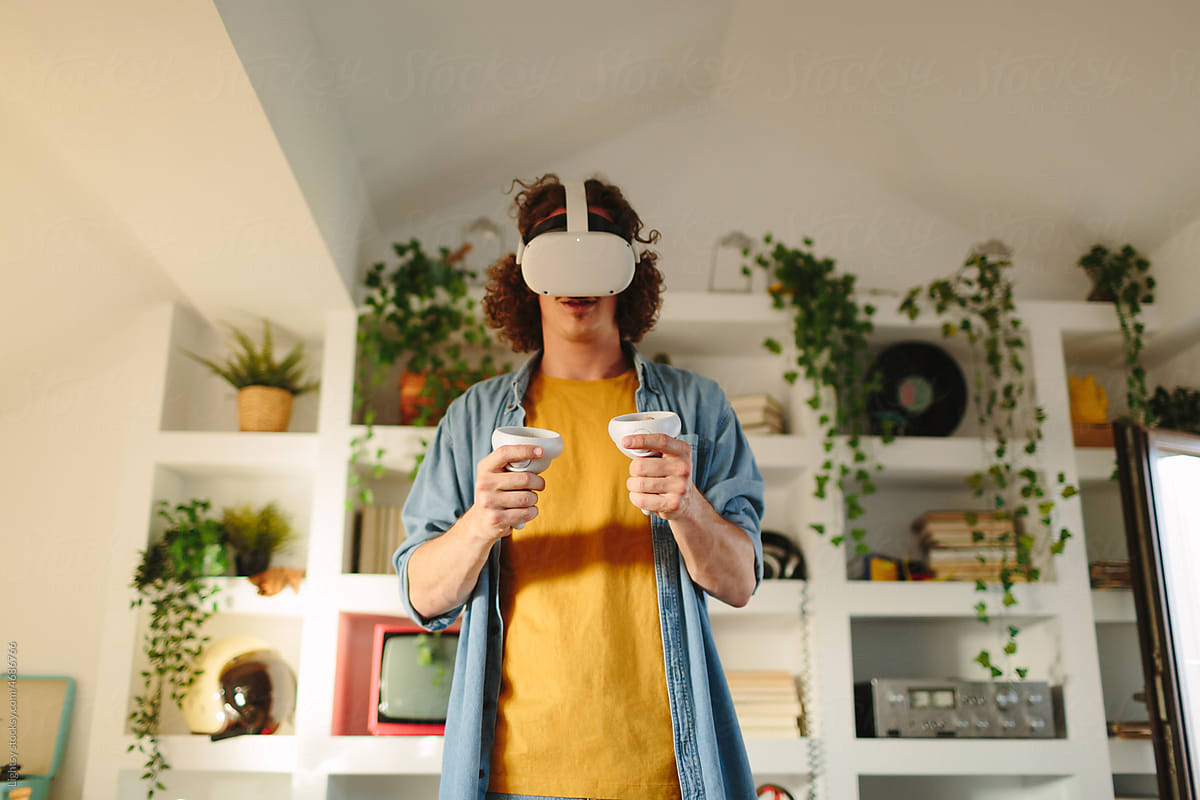 Man looking to his hands while using virtual reality headset