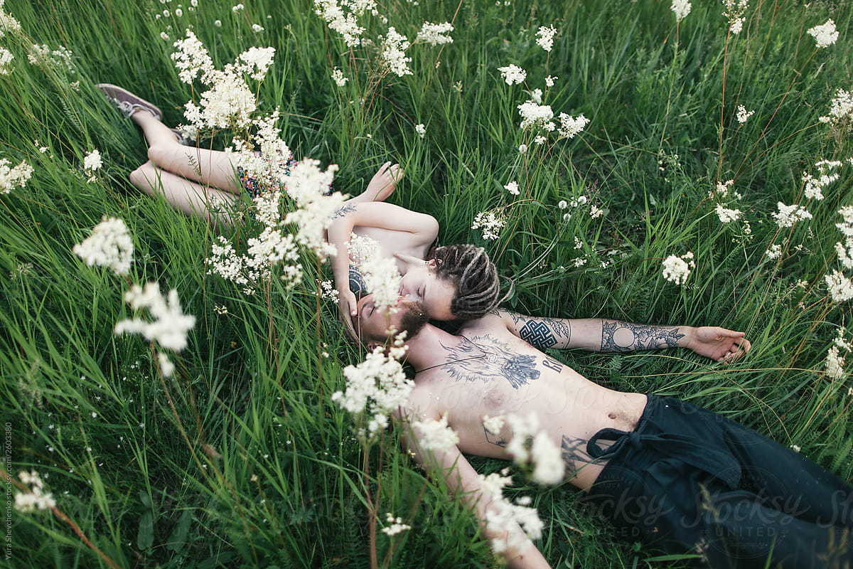 kissing in the middle of a meadow