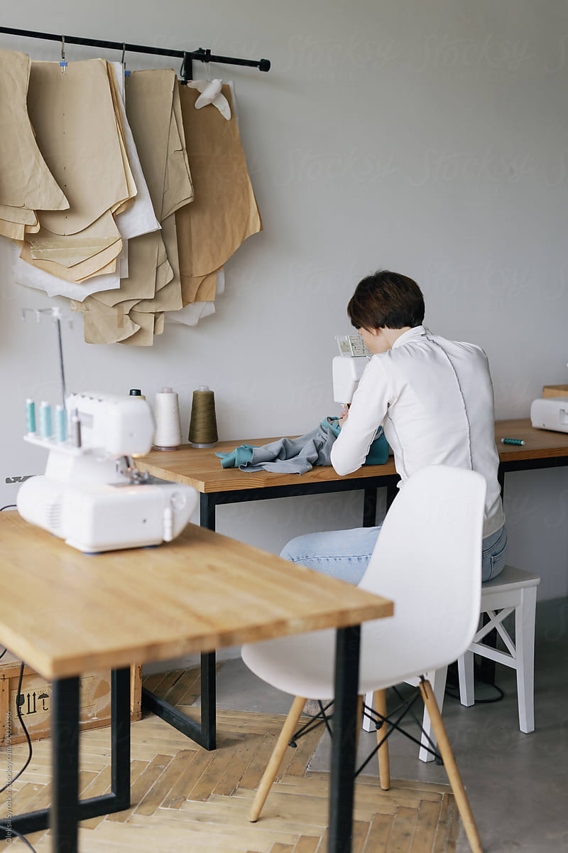 Sewing machine. Fashion industry. Diligent worker. Atelier