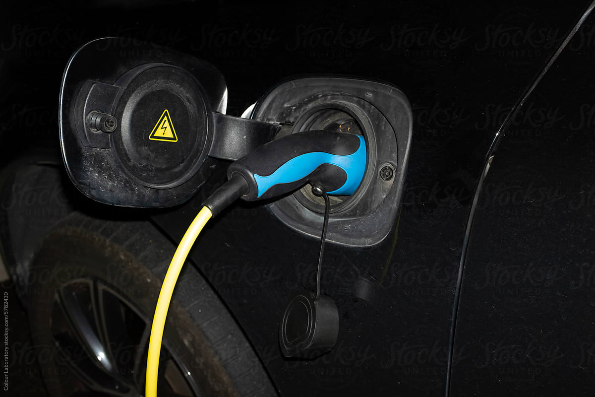 Photo of modern charger / wire in a electric car with hard flashlight