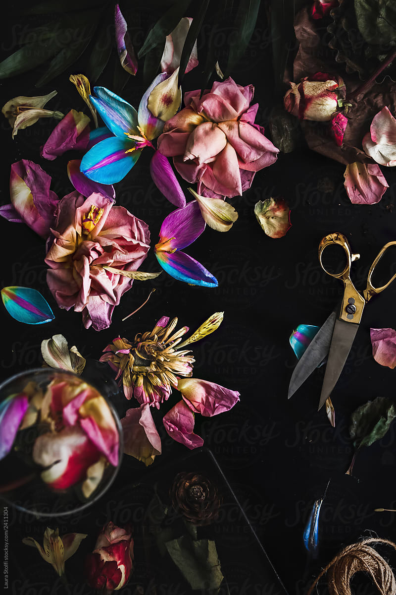 Withered colorful flowers on table flatlay