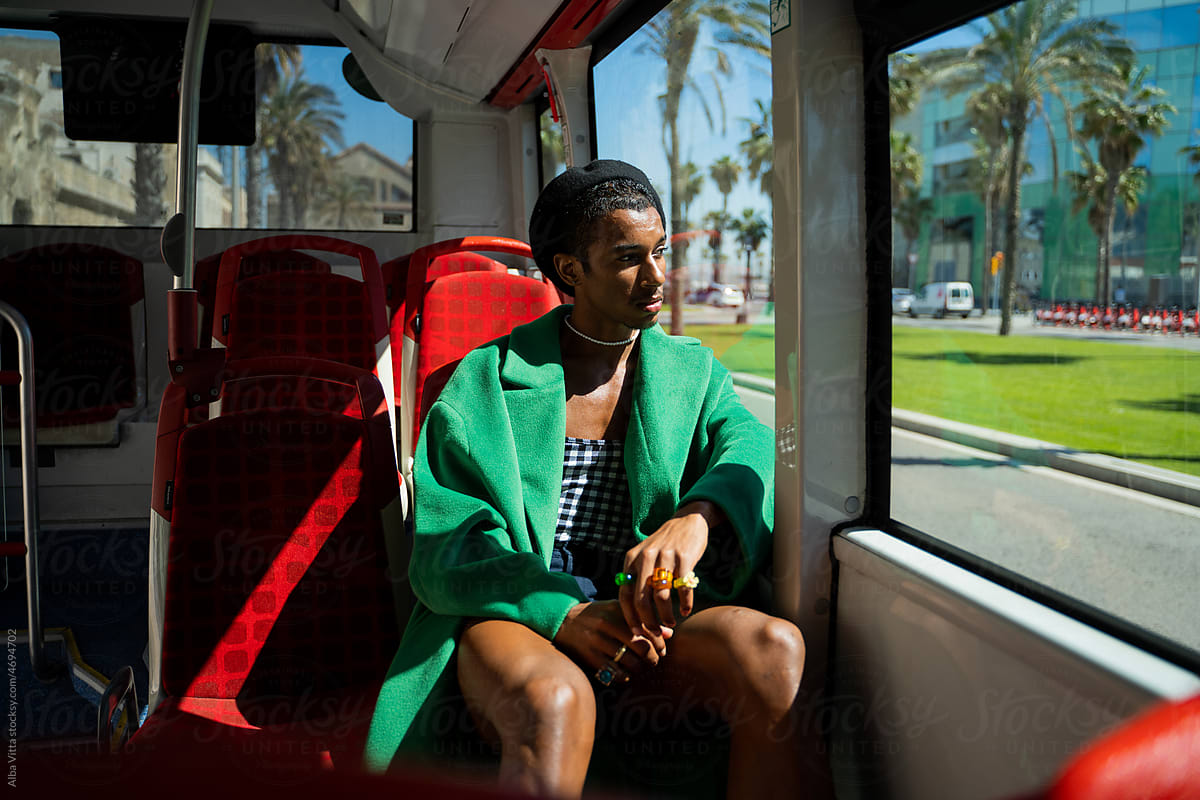 Black man traveling by urban bus