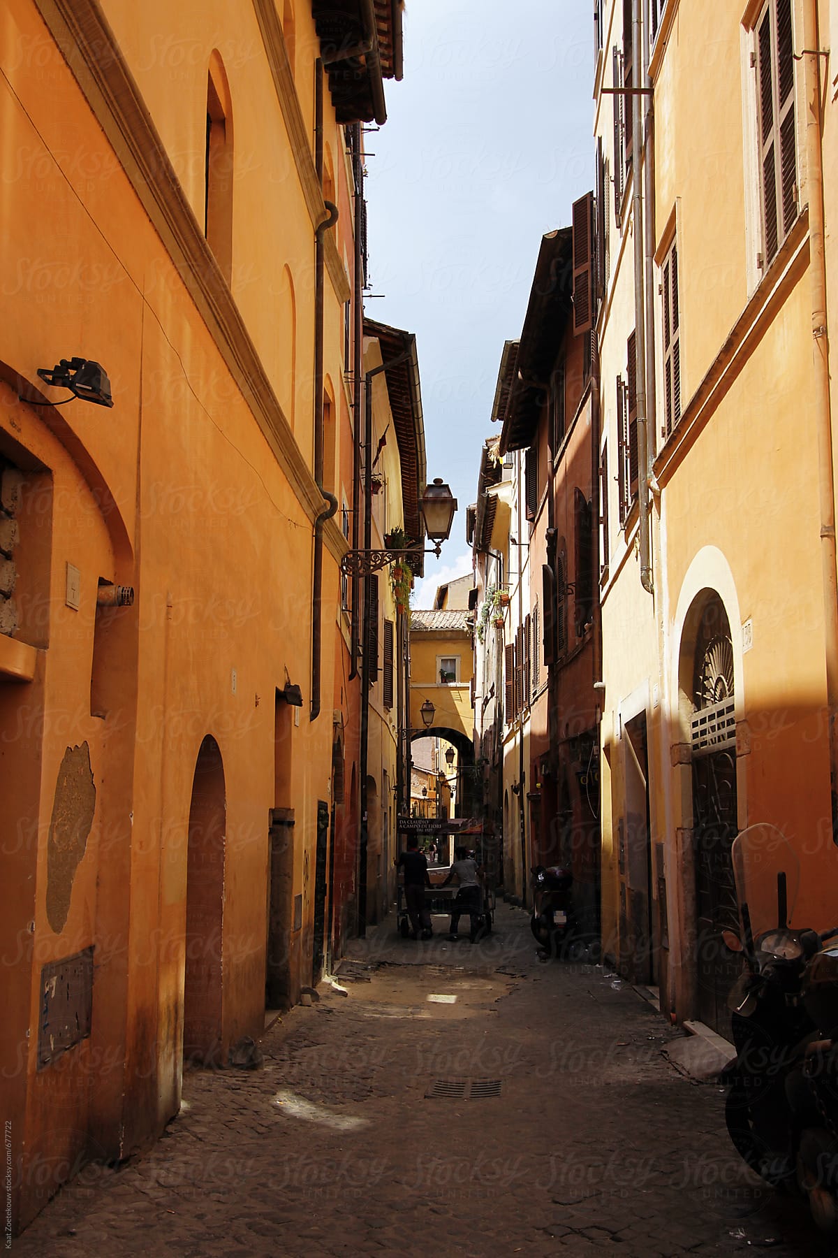 Sunlit back alley in Rome, Italy