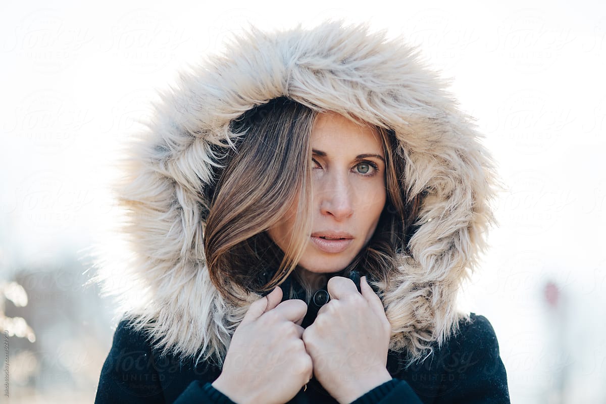 Portrait Of A Beautiful Woman With A Fur Trim Hood Over Her Head By Stocksy Contributor Jakob 