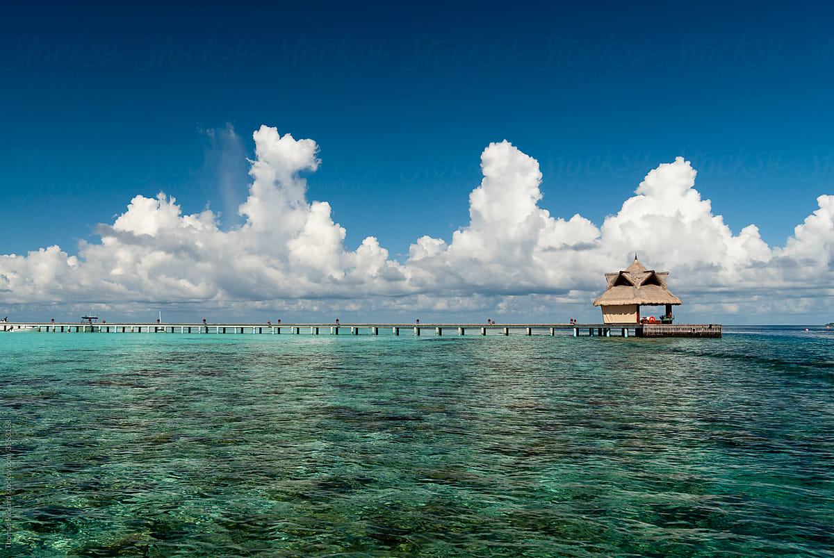 Over water pavilion, ocean and clouds, Maldives.