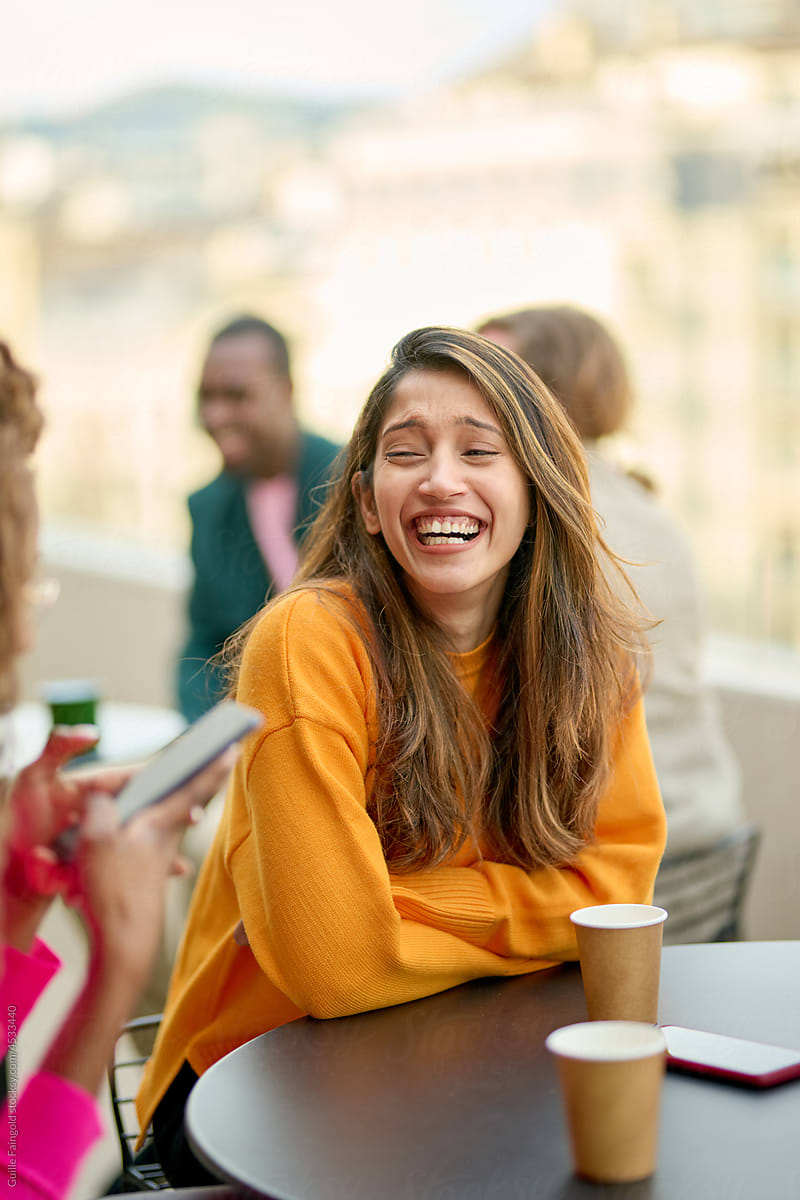 Laughing girl in cafe.