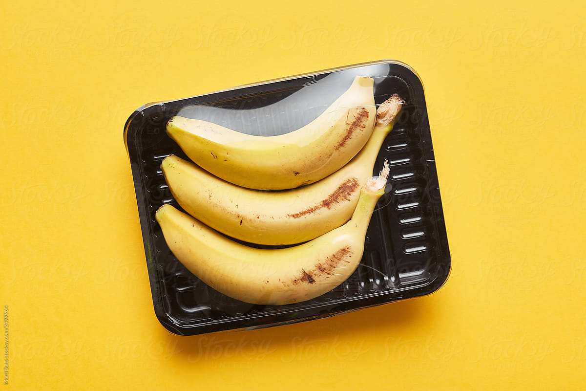 Bananas in box with plastic wrap