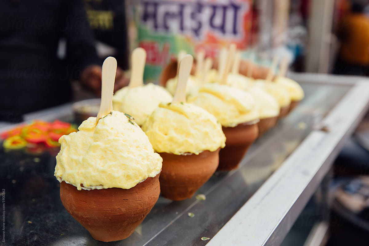 Clay cups with street vendor dessert in India